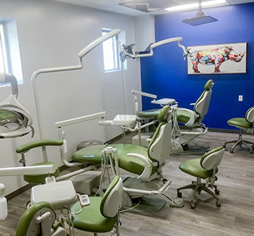 Row of green dental chairs