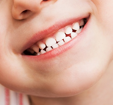 Closeup of hcild's healthy smile