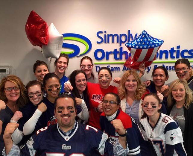 Team members dressed in football jerseys