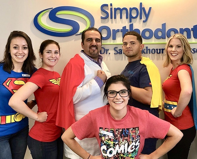 Team members dressed as comic characters