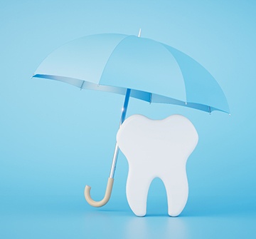 a model tooth underneath an umbrella