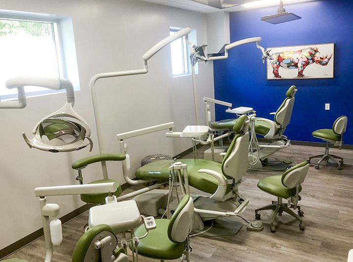Row of green orthodontist chairs