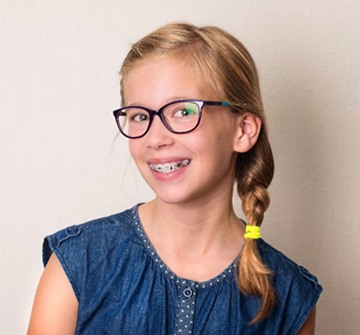girl braces glasses