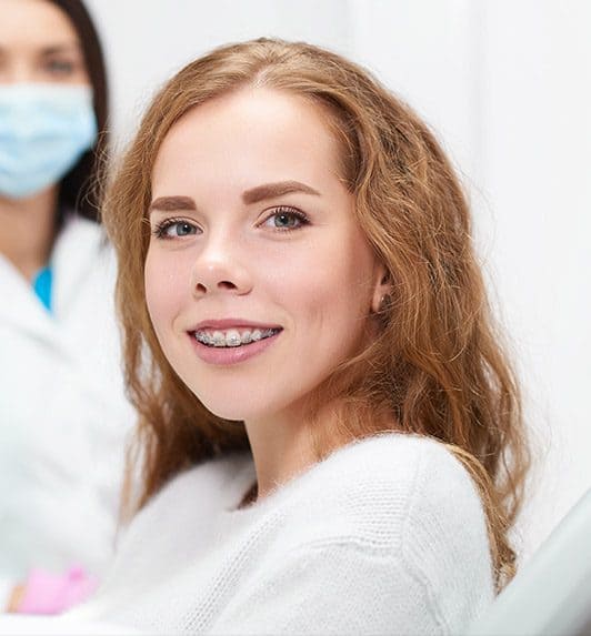 Smiling young girl with braces