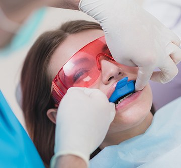 Child receiving fluoride application