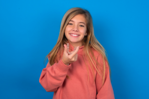 a teen with Invisalign smiling